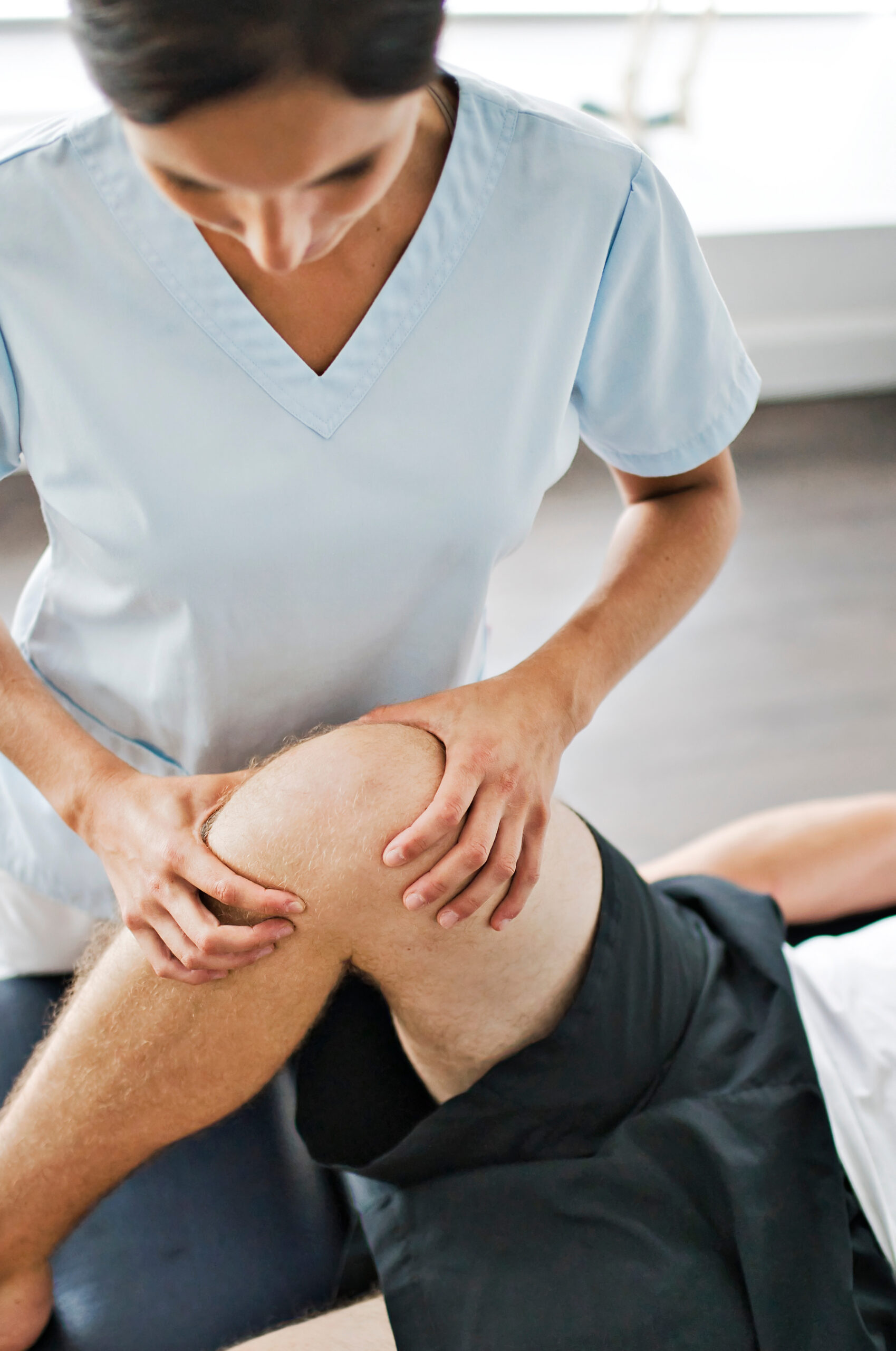 a,physiotherapist,doing,treatment,with,patient,in,bright,office